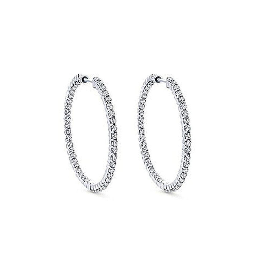 One-inch diamond hoop earrings, sparkling on white background.