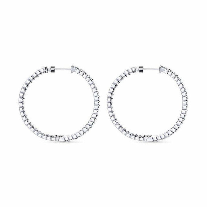 Diamond-encrusted 1-inch hoops; elegant, classic design.
