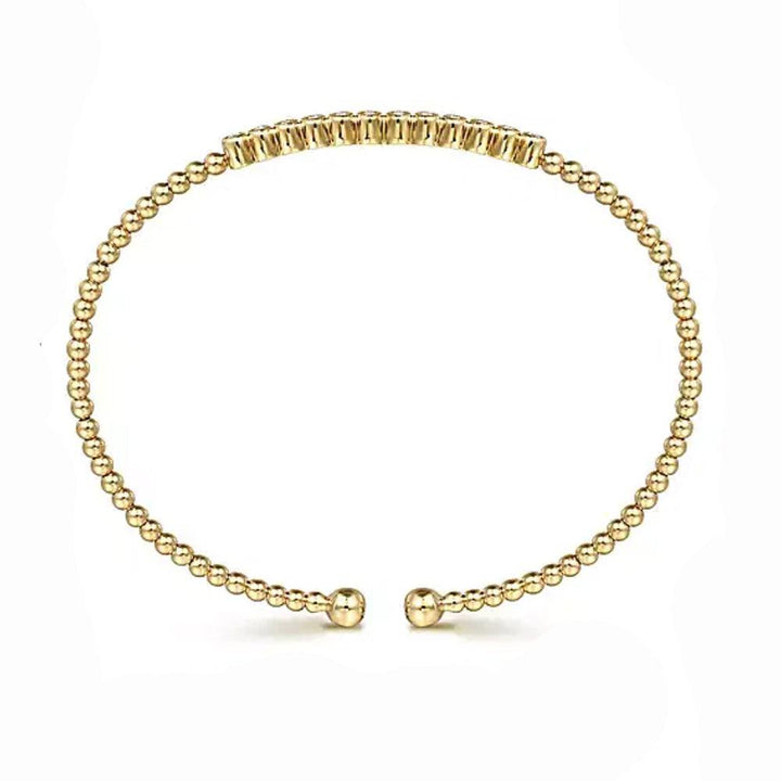 14K gold beaded bangle with a row of diamonds.