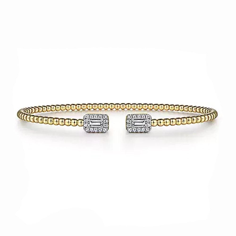 14K gold beaded cuff bracelet featuring baguette diamond accents.