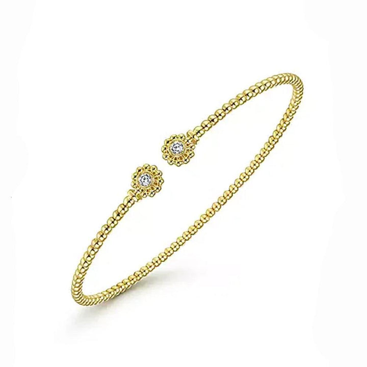 14K yellow gold Bujukan split cuff bracelet with diamond flower caps.