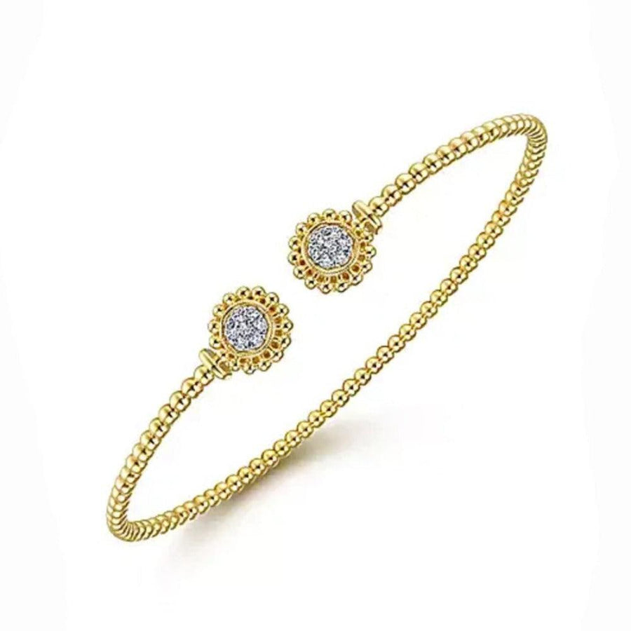 14K yellow gold open bangle bracelet with pave diamond circles.