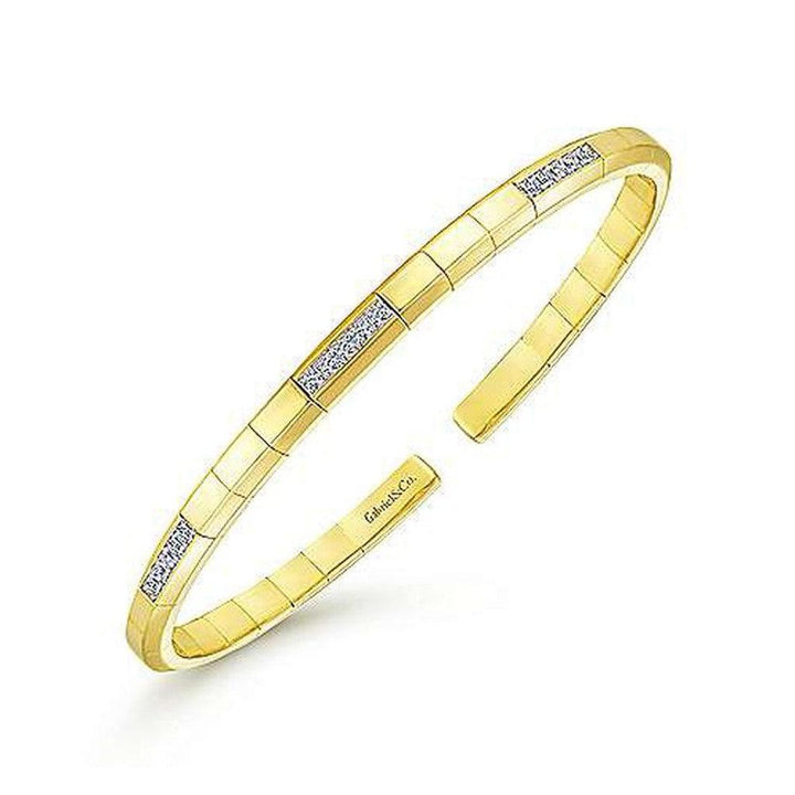 14k gold cuff bracelet with diamond accents.