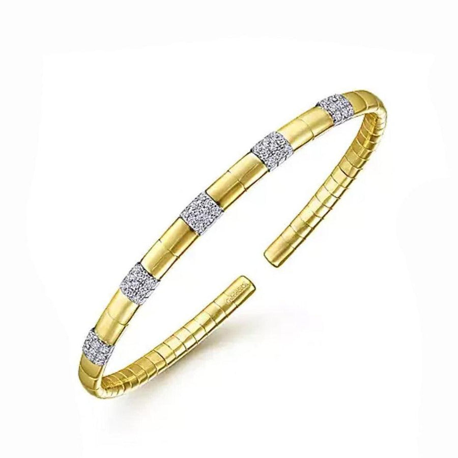 14k gold cuff bracelet with stationed diamonds; luxurious, elegant design.