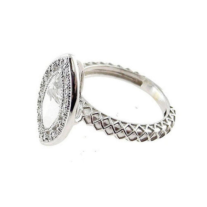 Marquise diamond ring in white gold;  intricate diamond-set halo and textured band.