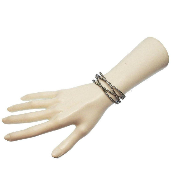 Silver crystal cuff bracelet, four rows of sparkling stones on a mannequin wrist.