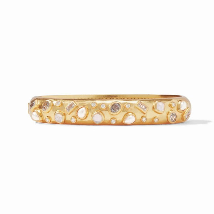 Gold bangle bracelet adorned with various sized pearls and gemstones.