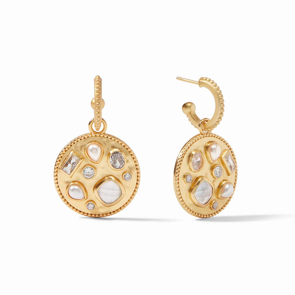 Gold hoop earrings with a textured circular charm featuring an assortment of white stones.