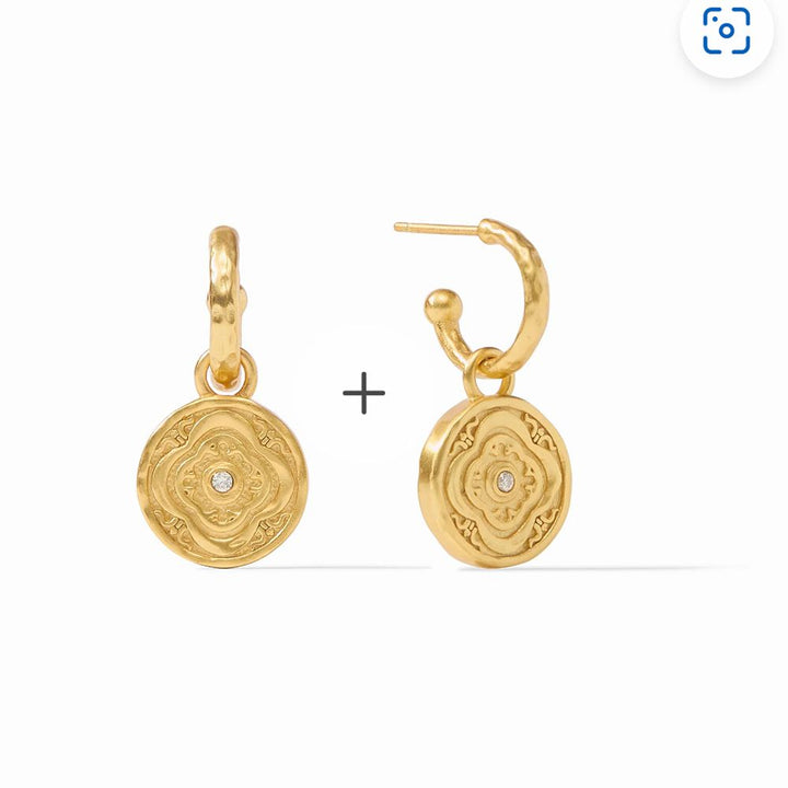 Gold hoop earrings with ornate charm featuring a tiny diamond.