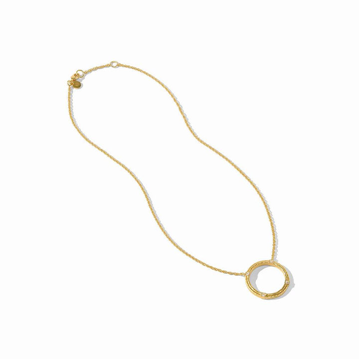 Gold necklace with textured circular pendant and small diamonds.