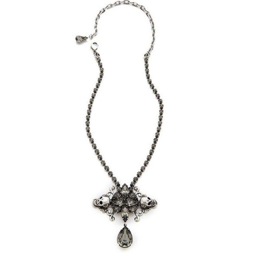 Elegant dark gray crystal pendant necklace with skull accents, featuring a teardrop charm.