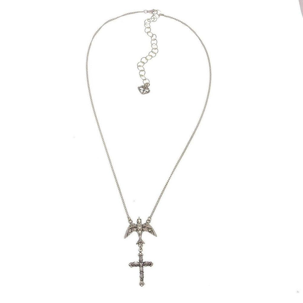 Silver necklace featuring a bird above a cross pendant