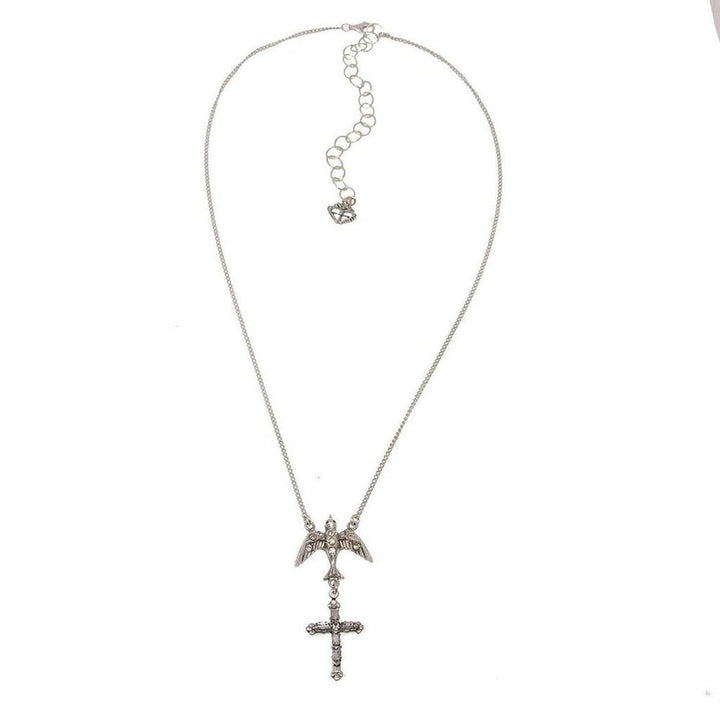 Silver necklace featuring a bird above a cross pendant