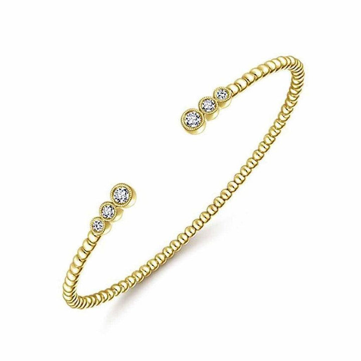 Gold beaded Bajukan Open Diamond bracelet with three bezel-set diamonds.