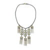 Beachcomber necklace: gold & bronze chain, off-white stones, geometric pendant with fringe accents.