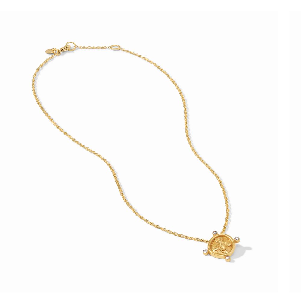 Gold bee pendant necklace with a twisted chain.