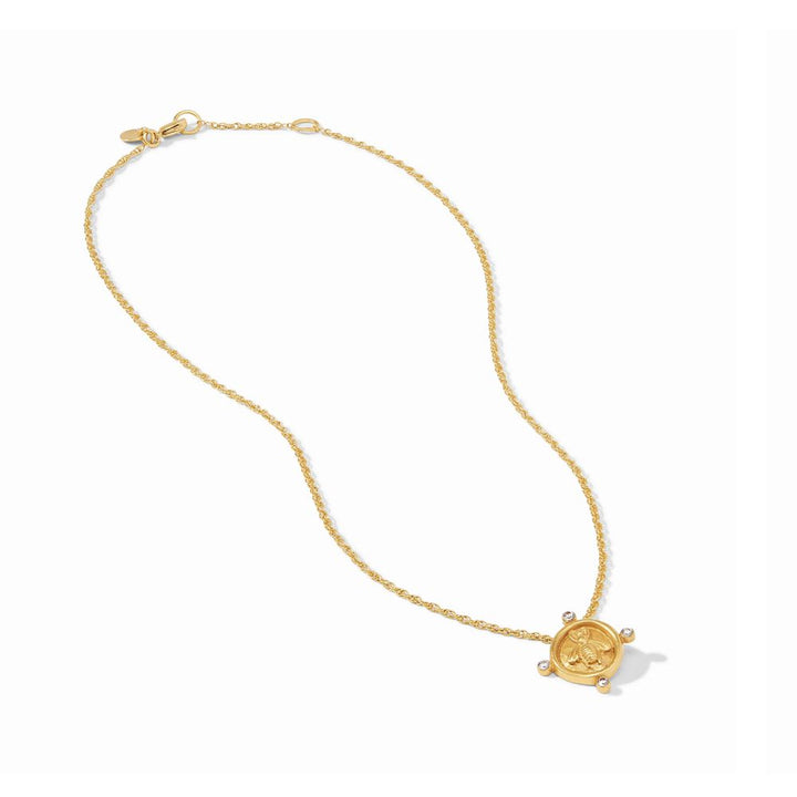 Gold bee pendant necklace with a twisted chain.
