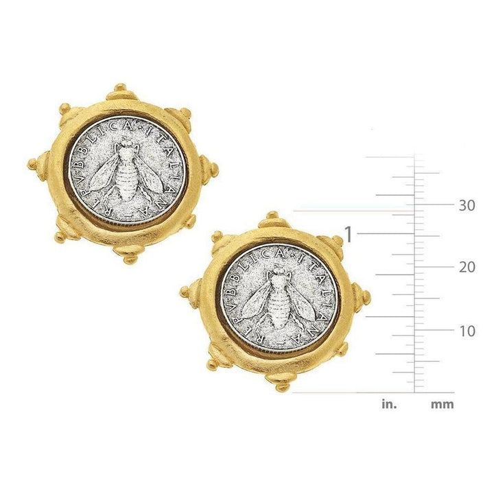 Gold-tone coin clip-on earrings featuring a silver bee design; size shown with ruler.