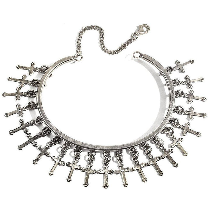 Silver cuff bracelet adorned with dangling cross charms.