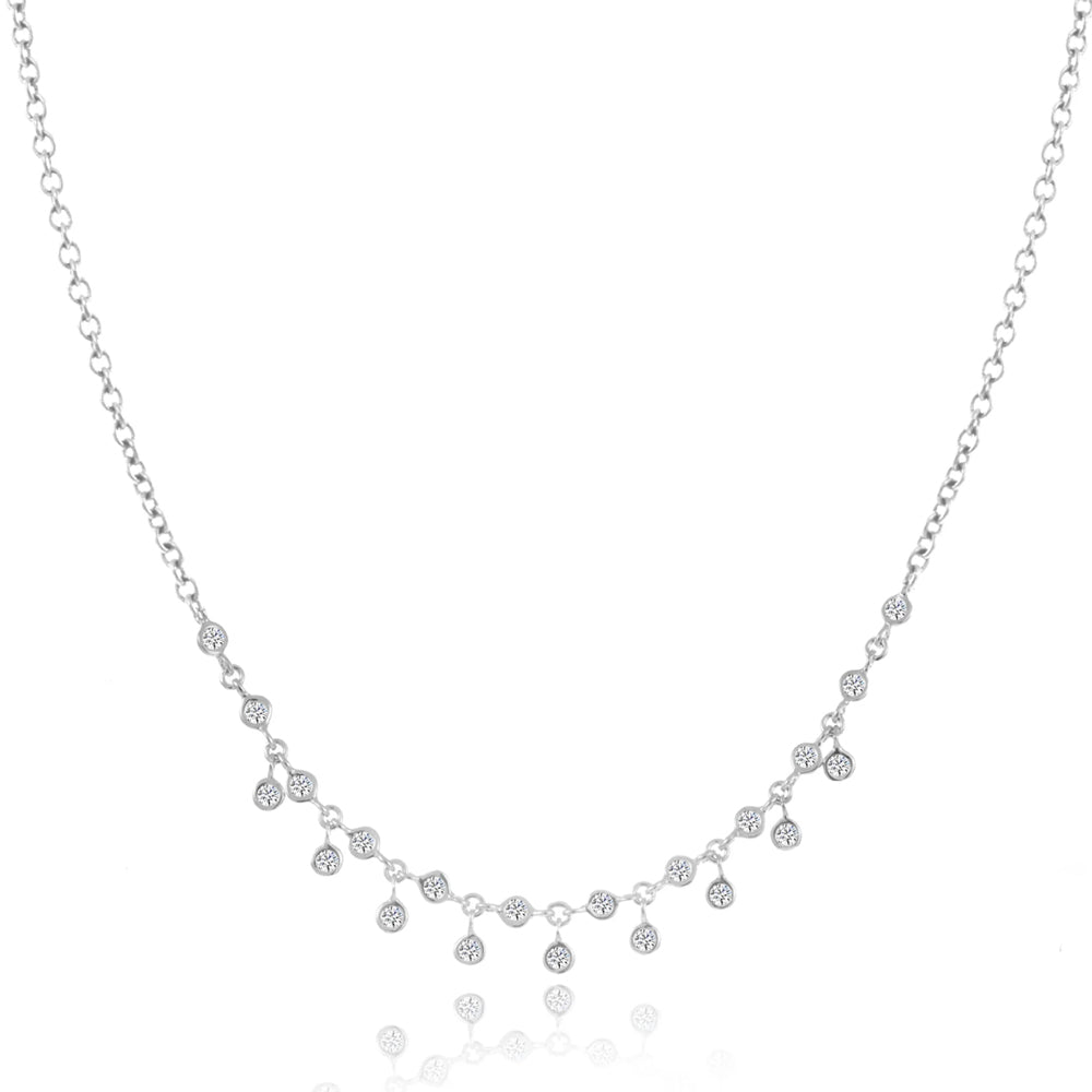 Elegant bezel diamond necklace with delicate dangling accents.