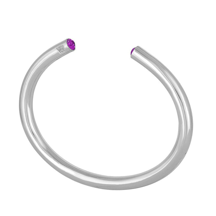 Silver bangle bracelet featuring a purple gemstone.