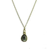 18k gold necklace featuring a pear-shaped black diamond pendant.