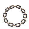 Black and rose gold link necklace with black onyx and clear cubic zirconia accents.