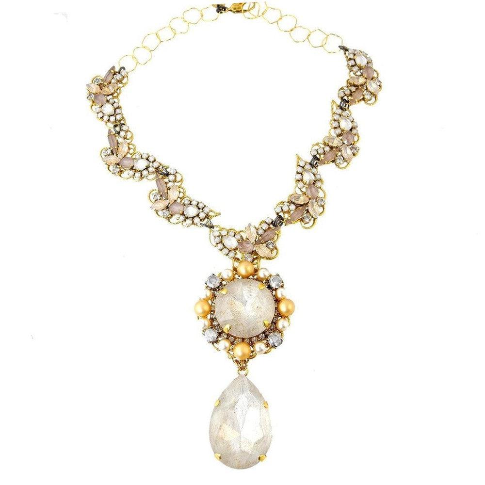 Elegant gold necklace with pearlescent and blush-toned stones, featuring a large teardrop pendant.