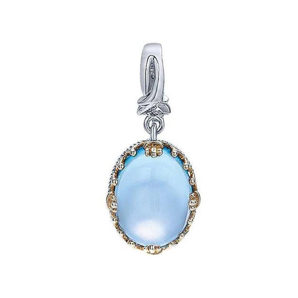 Oval blue topaz pendant, silver and gold accents, elegant design.