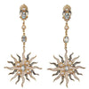 Blue Topaz and Pearl Sunburst earrings: Gold, sunburst design with blue topaz and pearls.