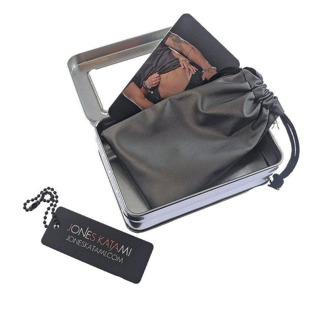 Vintage medallion bracelet in a metallic tin gift box with drawstring pouch.