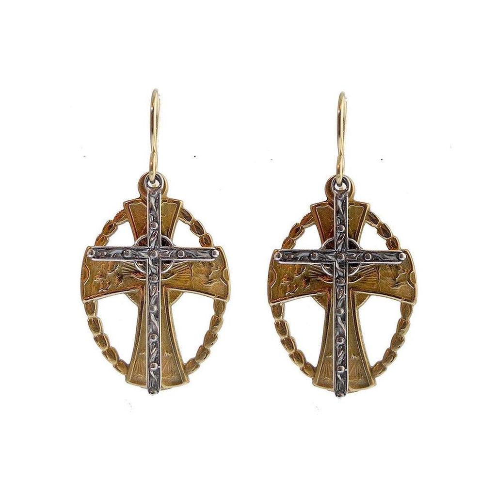 Bronze and silver cross earrings with intricate detailing.