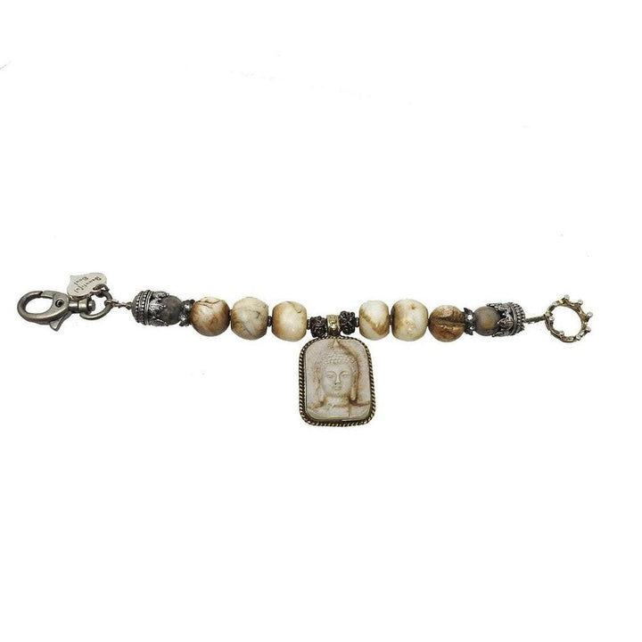 Beaded bracelet featuring a Buddha amulet, accented with antique-style metal accents.