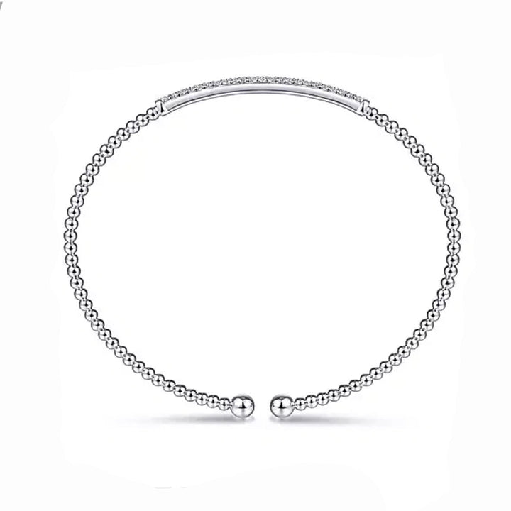 White gold beaded bangle bracelet featuring a diamond-encrusted bar.