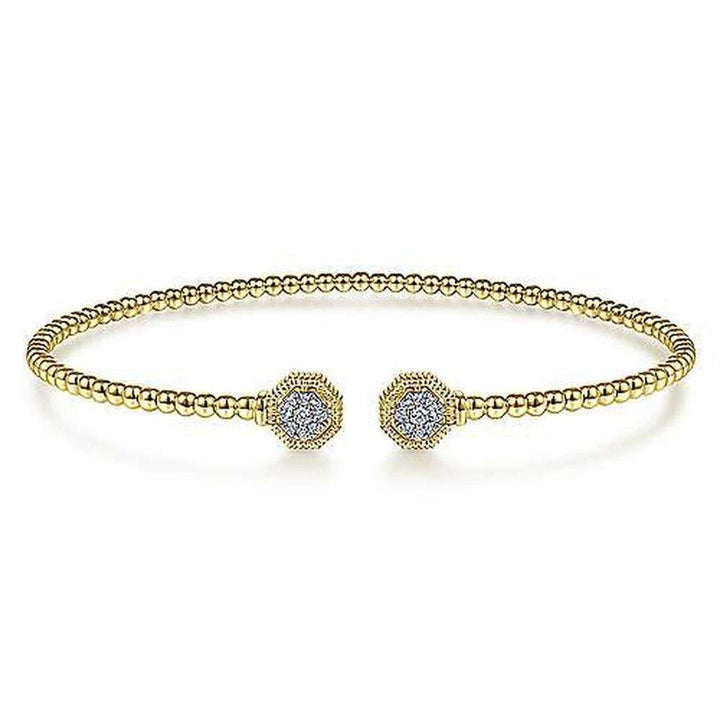 Gold beaded cuff bracelet featuring hexagon diamond accents.