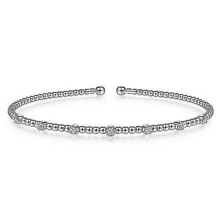 Beaded diamond bracelet with small, clustered diamonds.