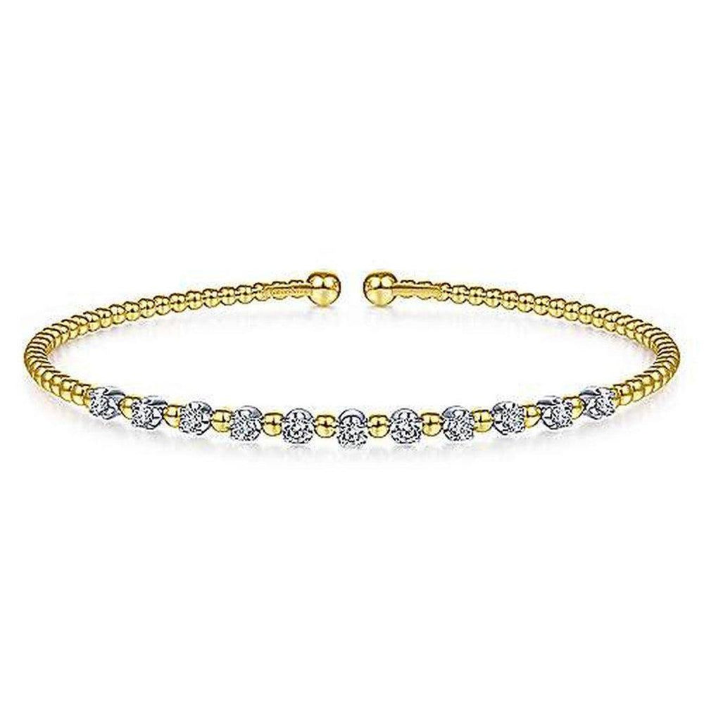 Gold beaded cuff bracelet accented with sparkling diamond stations.