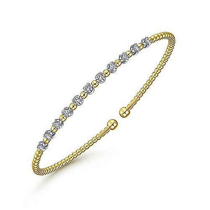 Bujukan Stationed Diamond Bracelet: Gold beaded bangle featuring a row of sparkling diamond accents.