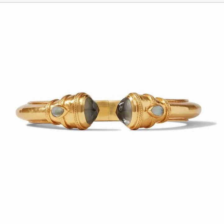 Gold cuff bracelet featuring smoky quartz and opal accents.