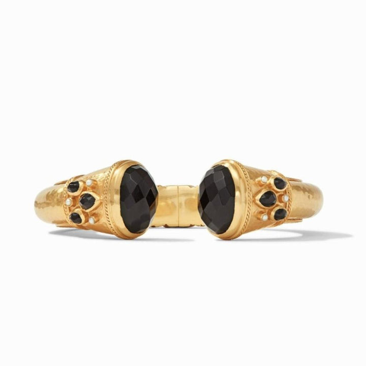 Gold hinged cuff bracelet with black gemstones and pearl accents.