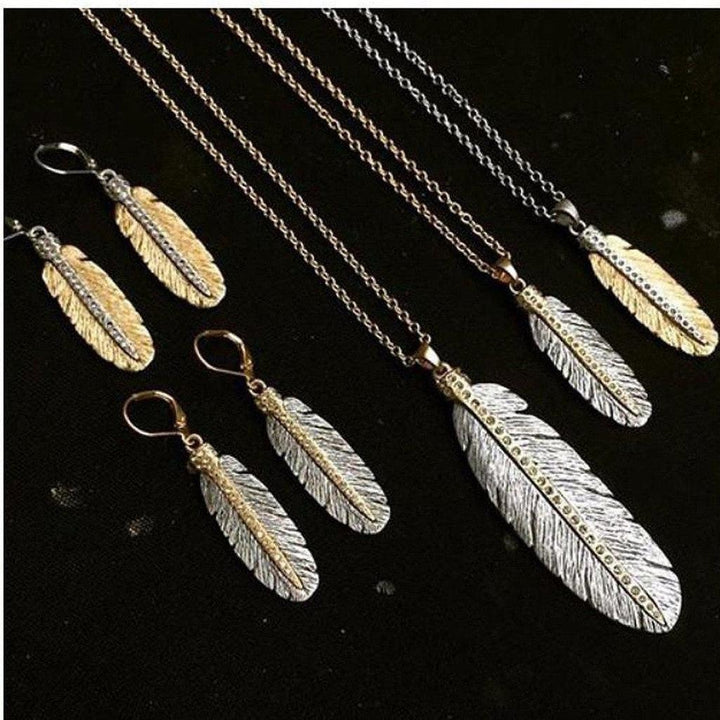 Feather necklaces and earrings with gold and silver accents, adorned with sparkling stones.