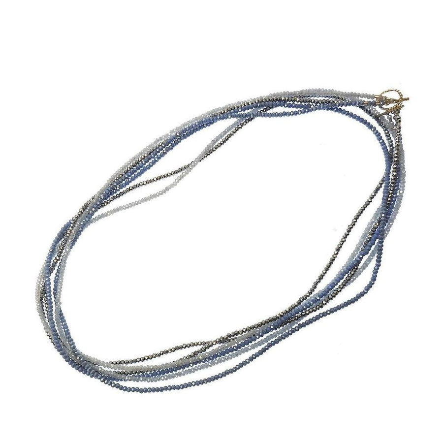 Multi-strand Cassandra necklace with ombre blue and gray crystals.