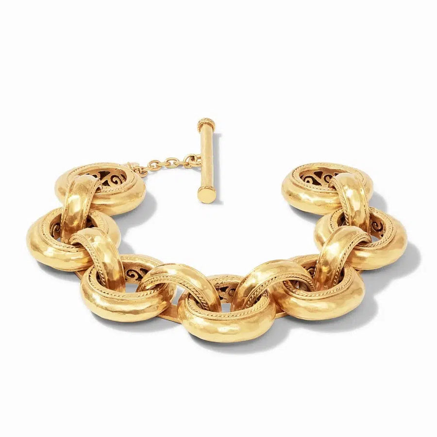 Gold Cassis Link bracelet with textured, interlocking circular links and a toggle clasp.