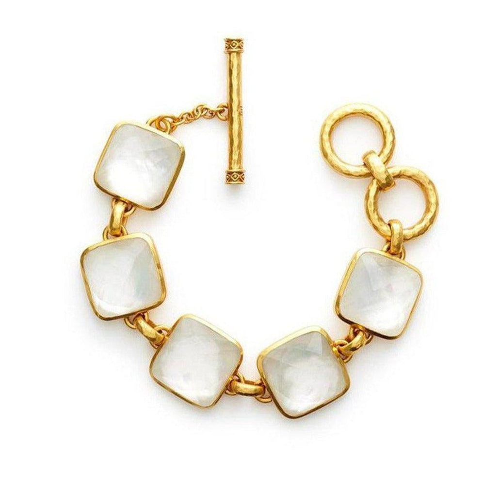 Gold bracelet featuring square white stones and a toggle clasp.