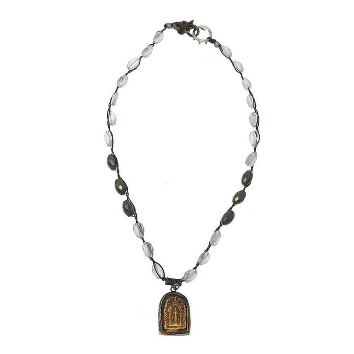 Elegant necklace featuring clear and pyrite beads, accented with an ornate gold pendant.