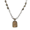 Celestial Shrine Necklace: Bronze pendant with etched detail, clear quartz & pyrite beads on brown cord.