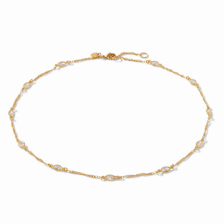 Gold station necklace with marquise-cut clear stones.