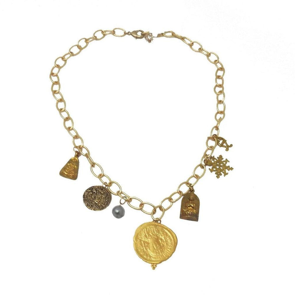 Gold chain necklace featuring multiple charms, including coins, a pearl, and religious symbols.