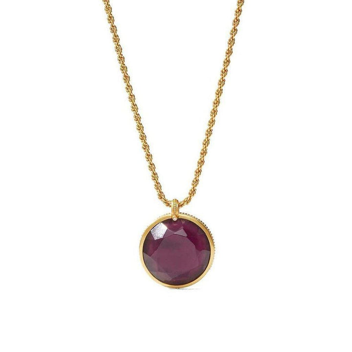 Gold rope chain necklace with a large, dark purple gemstone pendant.