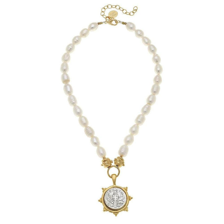Elegant pearl necklace with a gold coin pendant featuring a cross design.